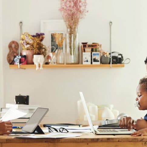 mother and family working from home at kitchen table